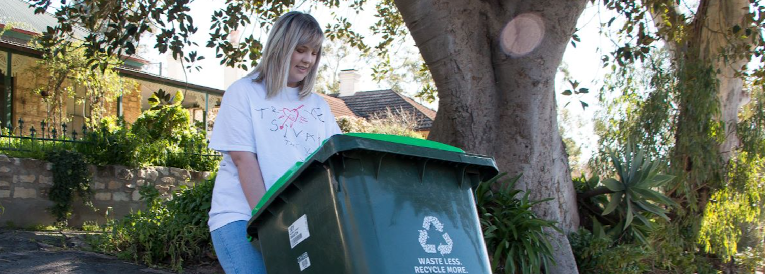 woman disposing of green waste