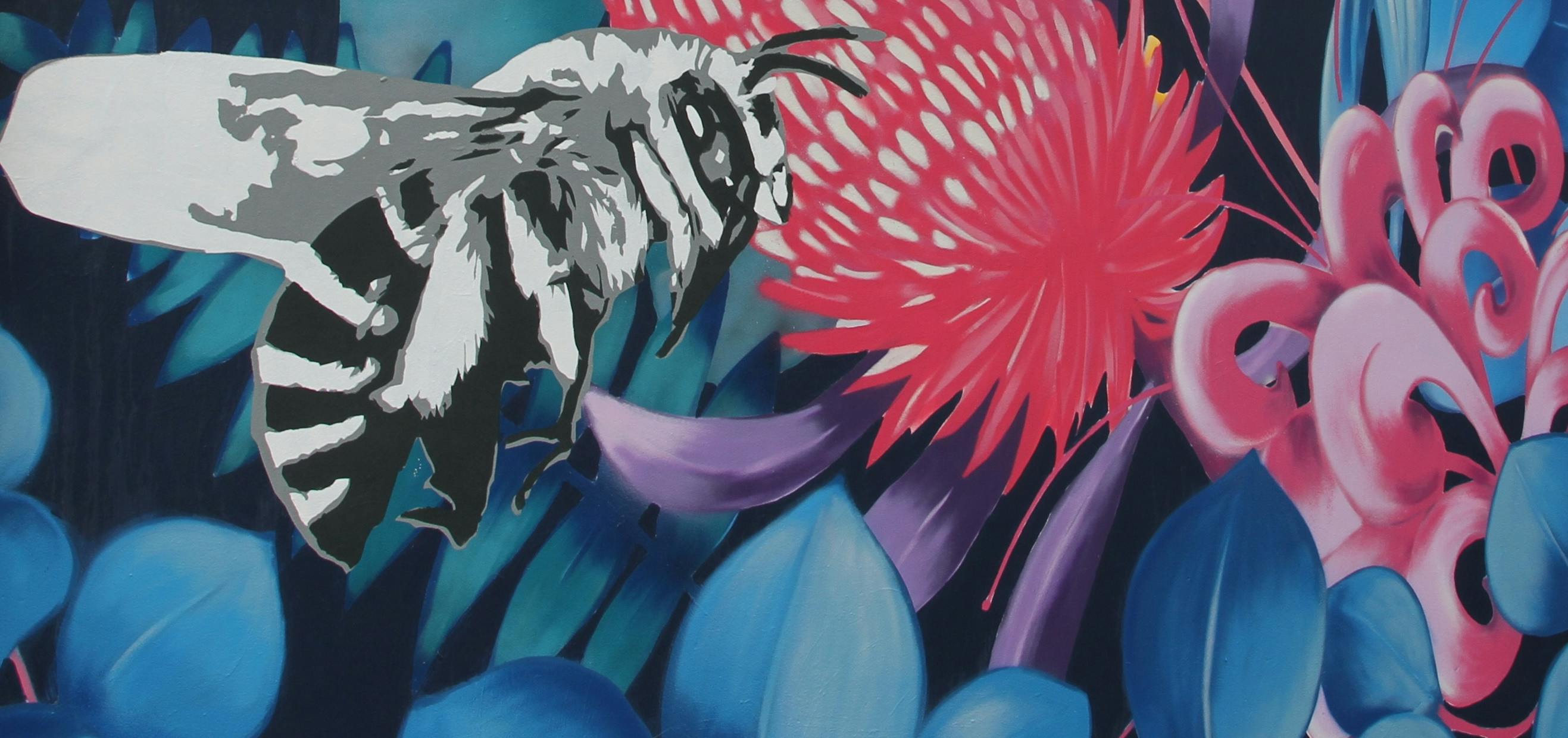 Colourful mural depicting a bee and native flowers