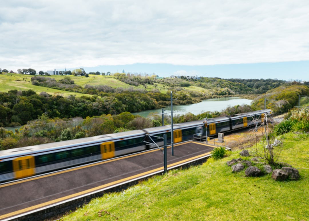 Electric train leaving a platform from Meadowbank Station in Auckland. 
