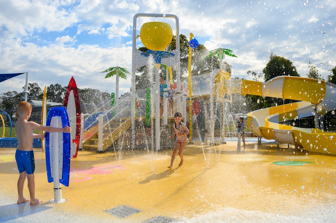 Children playing at a water fun park
