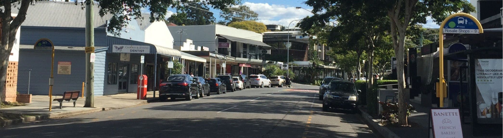 Shops and businesses along Baroona Road from the eastern entry.