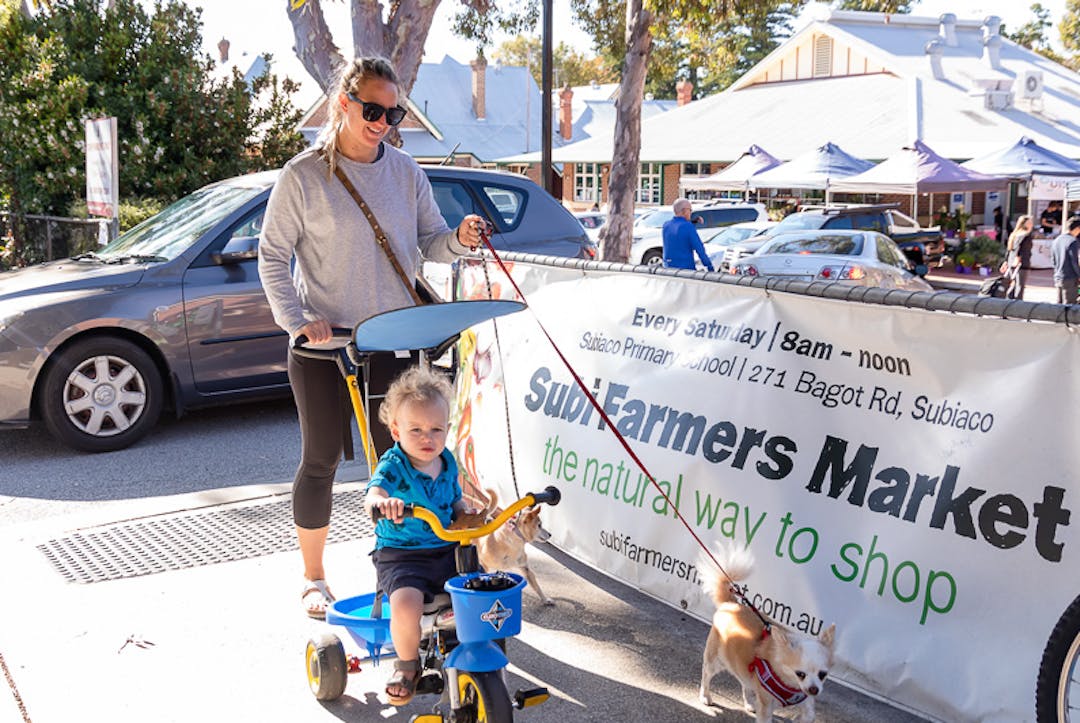 Mother with a pram, a child and a dog at Subi Farmers Market