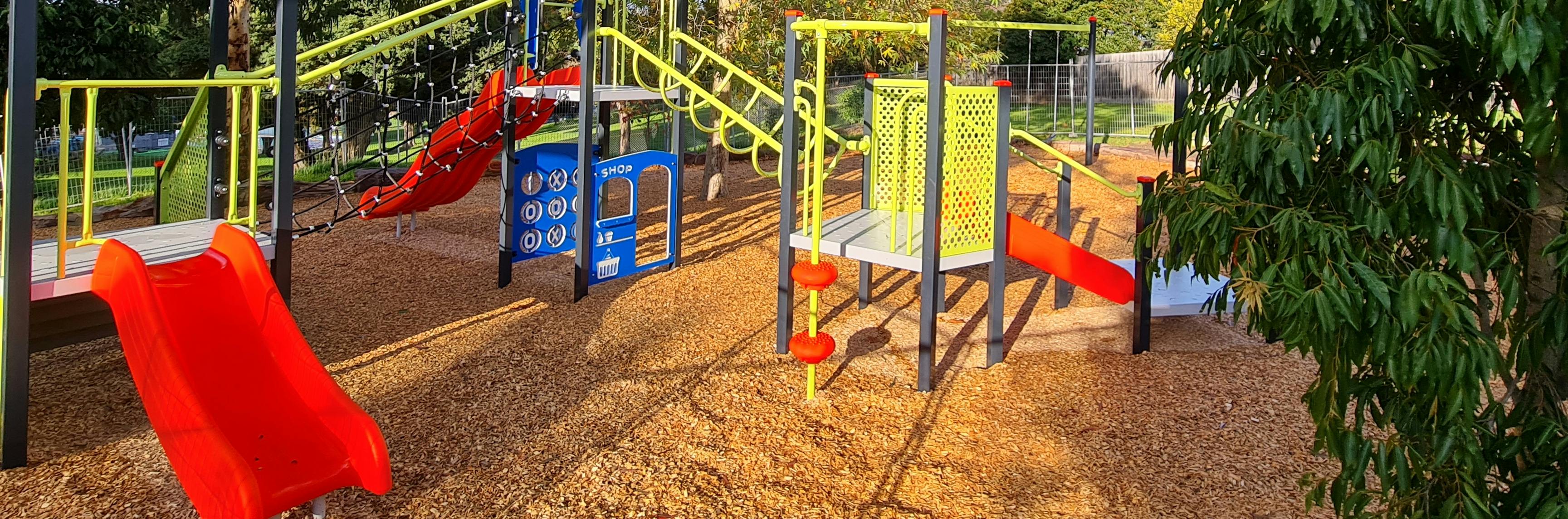 Banner with Playground at Ted Ajani Reserve