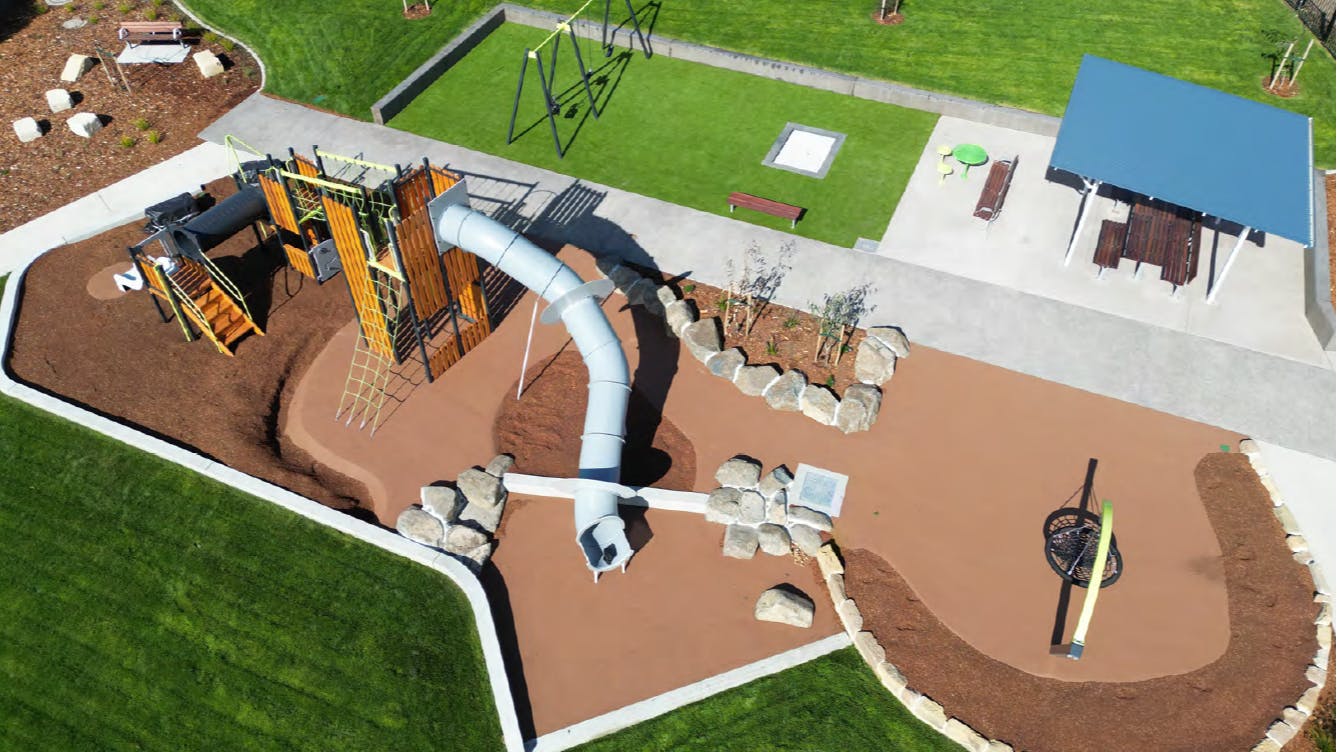 An aerial photo taken from a drone showing the new playground, picnic shelter and grassed areas at the new Park. 