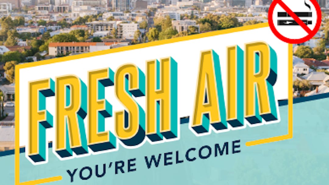 Smoke Free 'Fresh Air' logo superimposed on an aerial view of Vincent and City skyline.