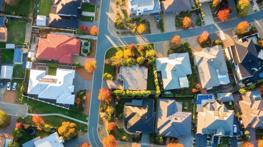 a whiteboard with post its and plans, linked together with string