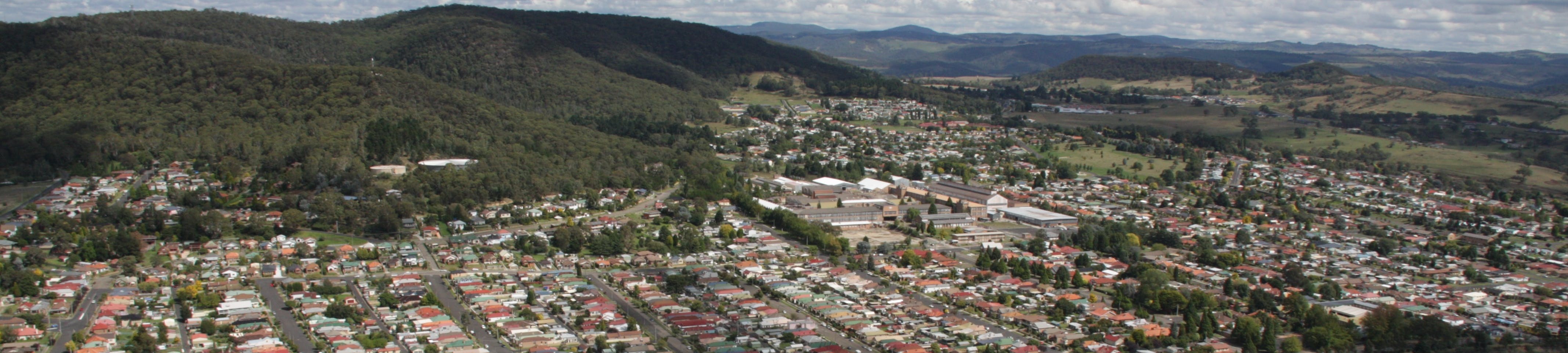 Aerial view of Lithgow Valley showing the township with the mountains in the background.