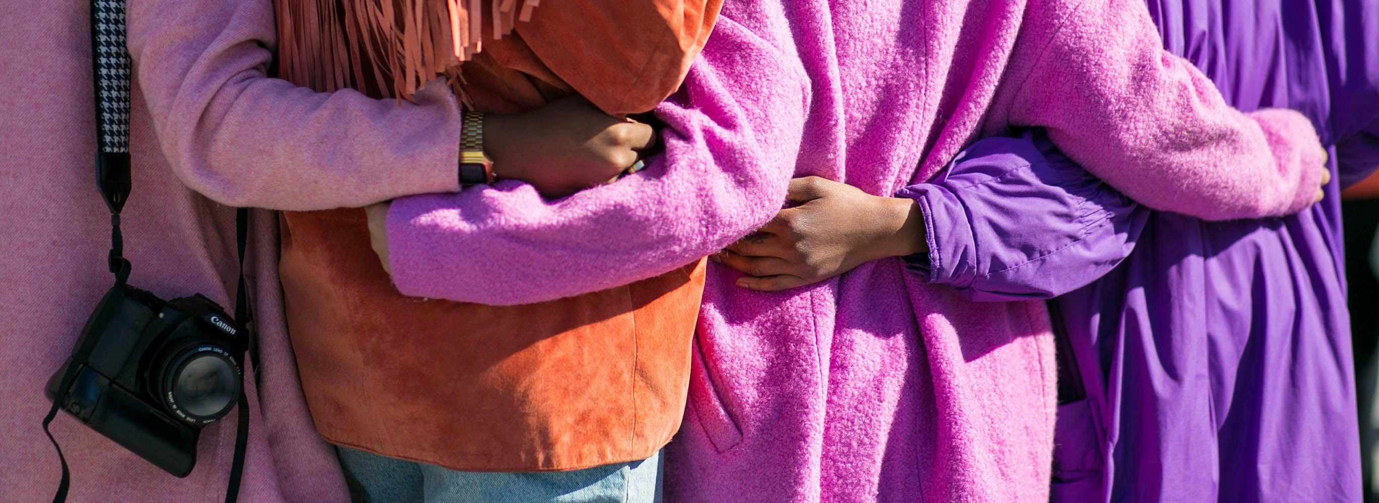 Group of Four Women Clasped behind Backs