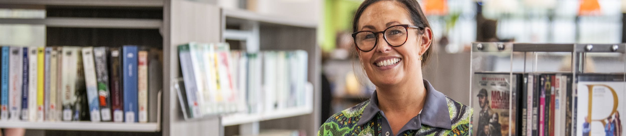 Librarian putting books away. 