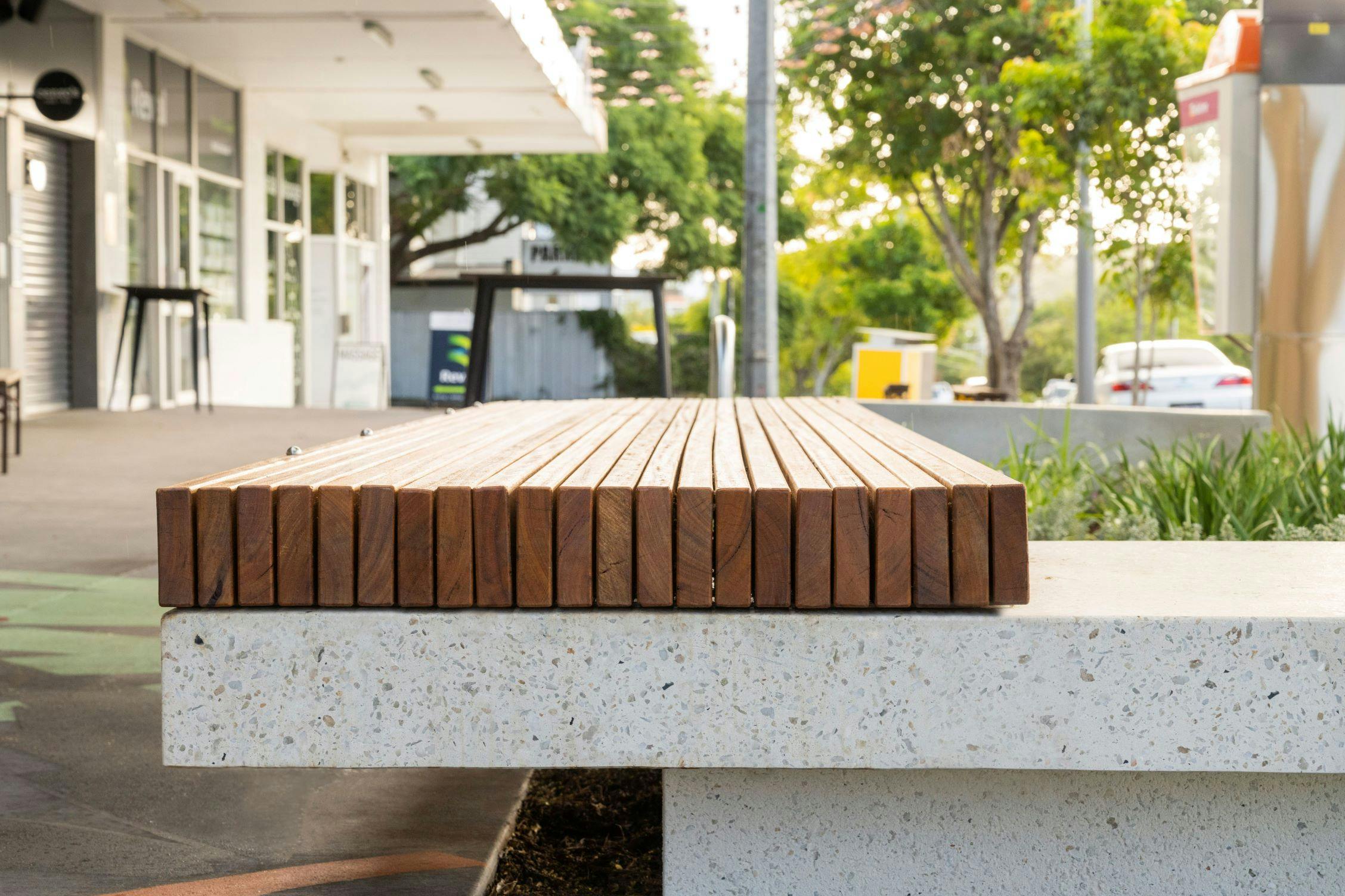 Close up of the new platform seating highlighting the timber detail and honed concrete aggregate finish.