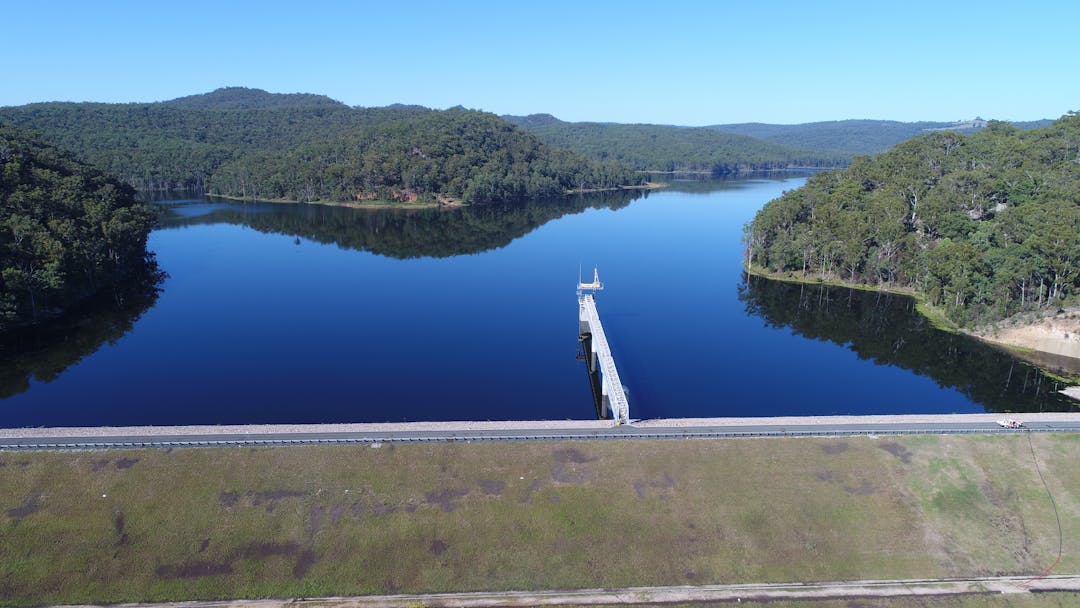 Aerial image of Shannon Creek Dam with clear blue sky above