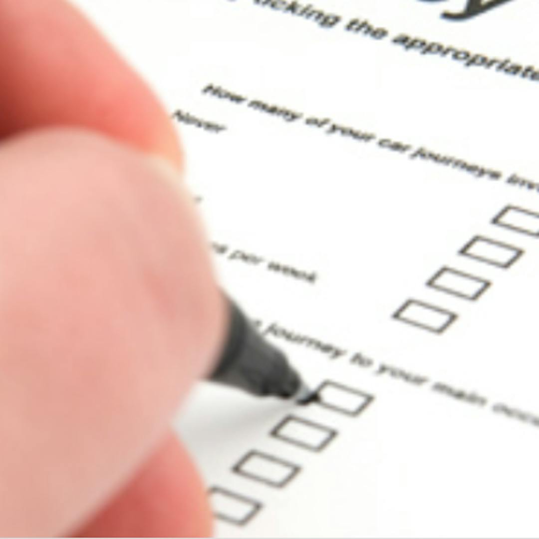 filling our a registration form person filling out a registration form