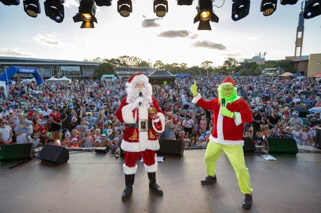 Santa and the Grinch have the stage at the City of Logan Christmas Carols 2021