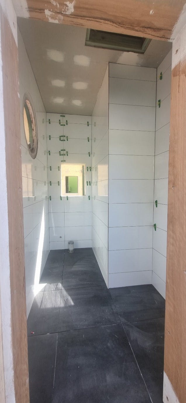 Internal wall and floor tiling progress - Barolin St Toilet Block.jpg