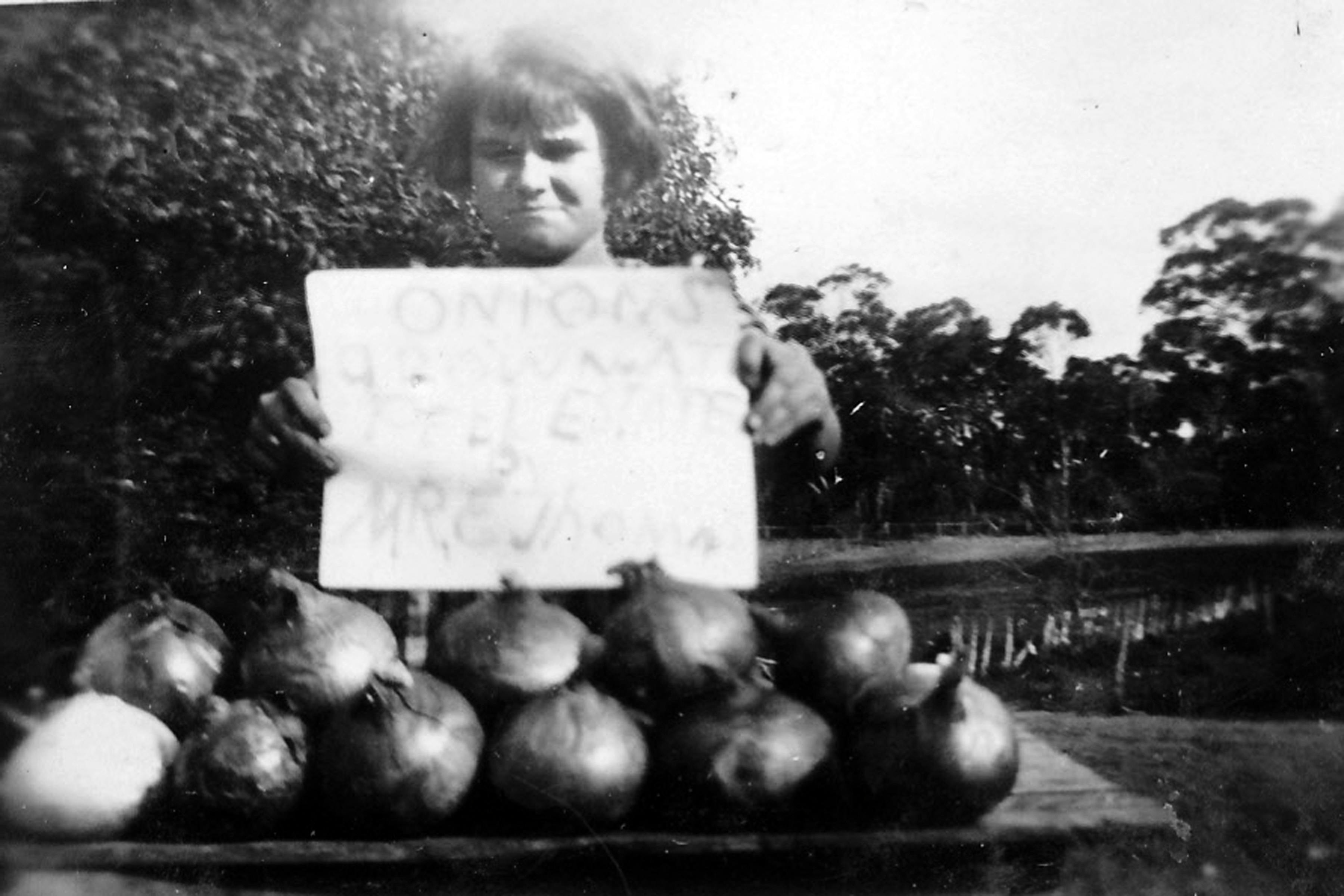 4 A young Ivy Thomas with some onions for sale in East Rockingham ca. 1918.jpg