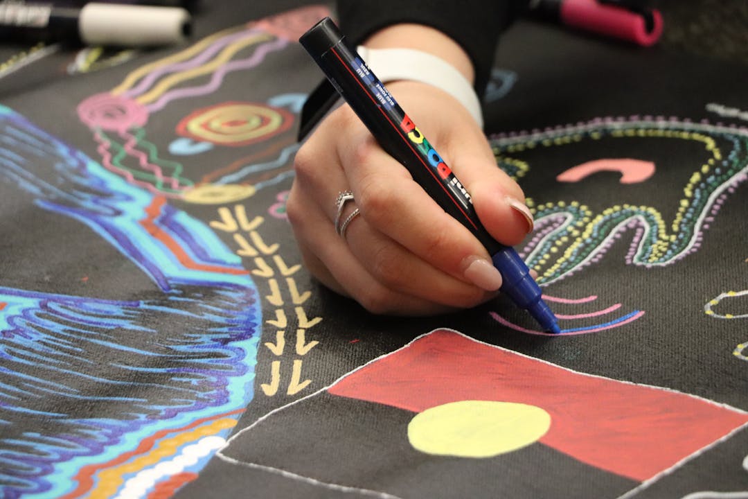 Students painting artwork 'Journey Through Time' 