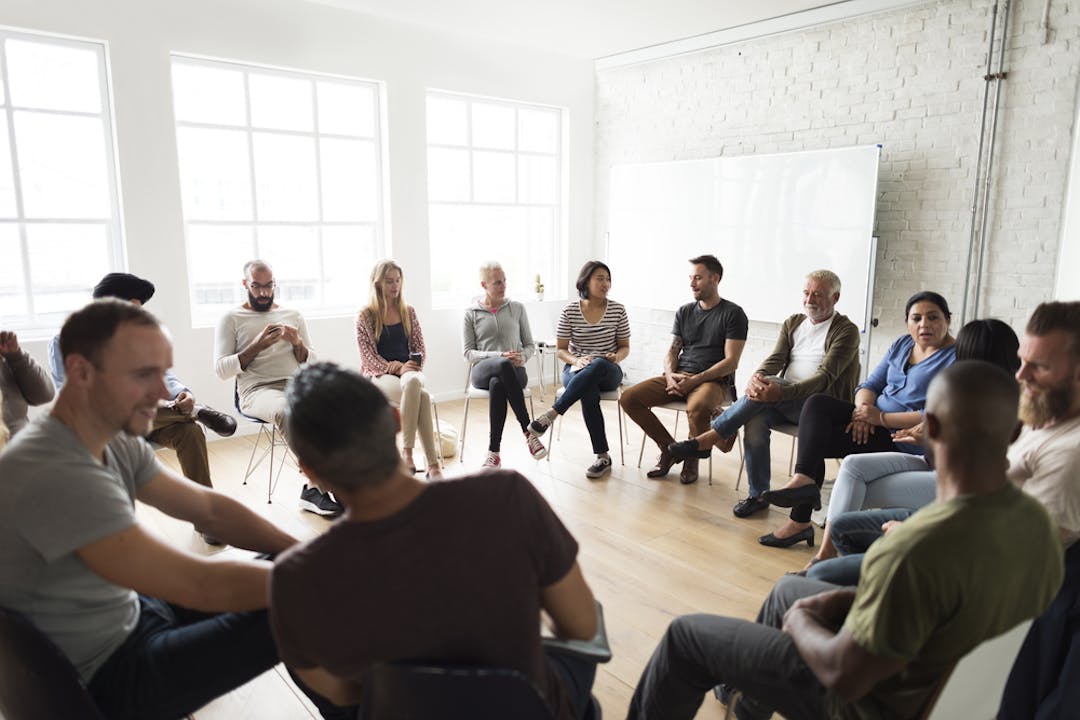 Group of people sitting in a circle