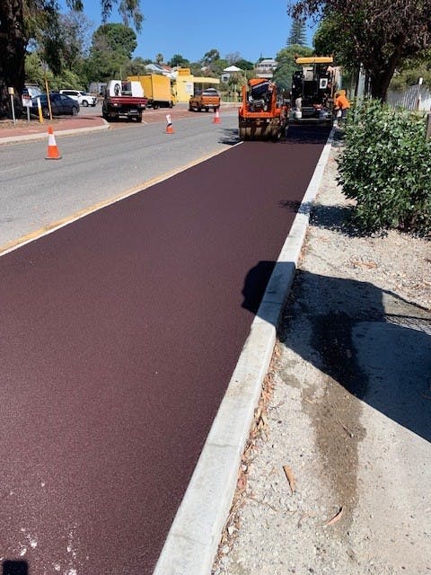 Laying of new red asphalt.jpg