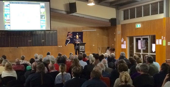 Screen presentation and speaker in a hall at Tamborine Mountain