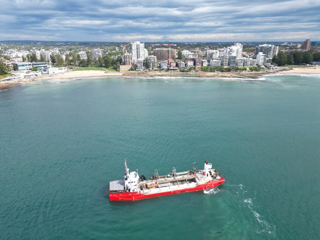 Ariel view from the ocean looking towards Cronulla. The sand dredging ship is at work in the foreground.