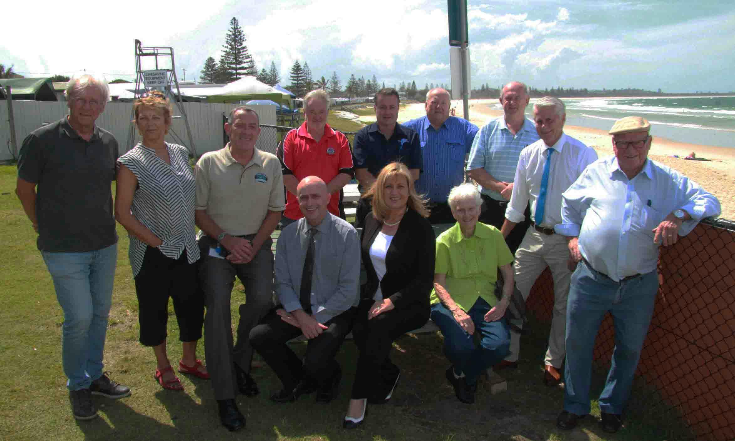 Council leaders, State and Federal Members, chamber delegates, resident association members, Tweed Coast Holiday Park representatives, Kingscliff Beach Bowls Club management and Cudgen Headland Surf Club delegates gather to celebrate the Federal funding.