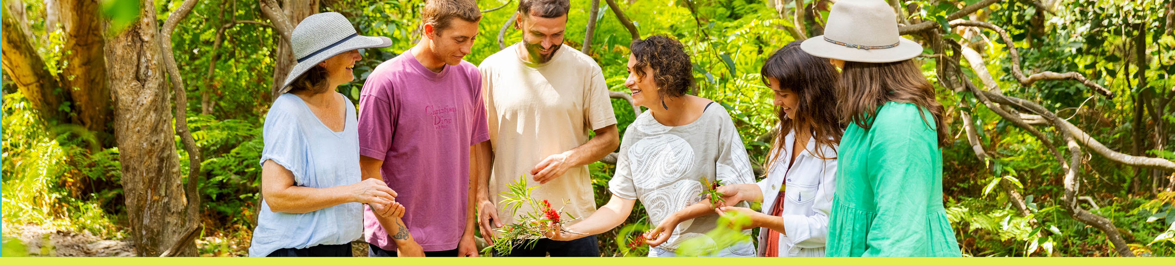 People connecting with flora through Indigenous interpretation. Image by Tourism and events Queensland.