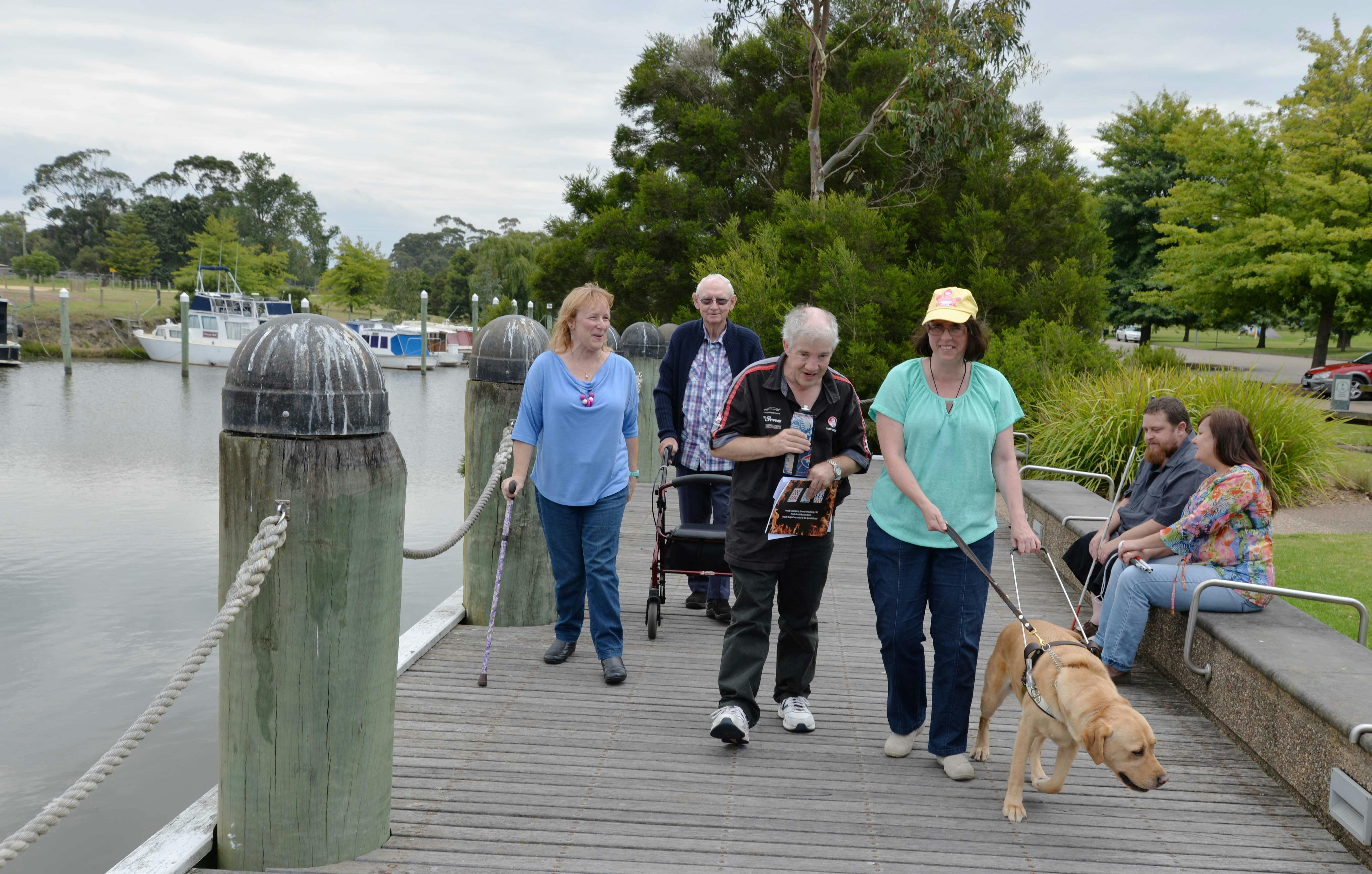 WAIAG members walking along boardwalk