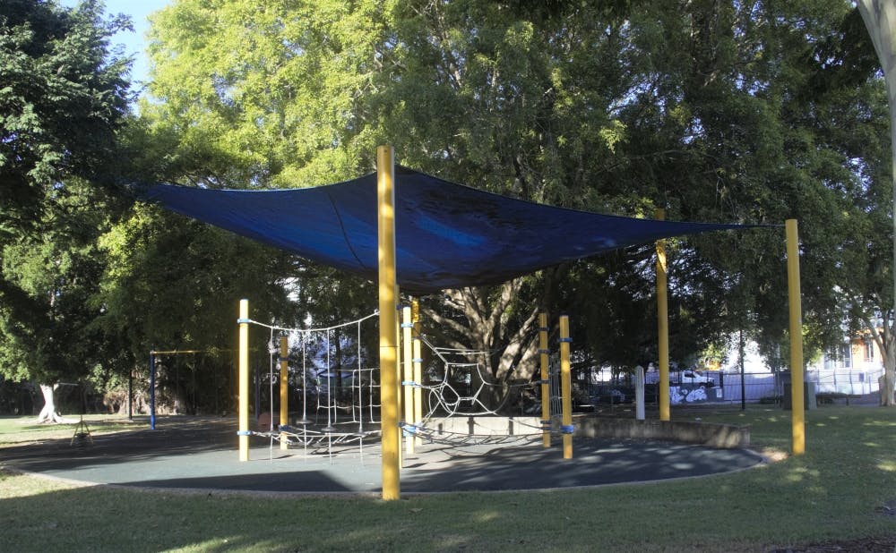 Playground in Woolloongabba Rotary Park with trees in background. 