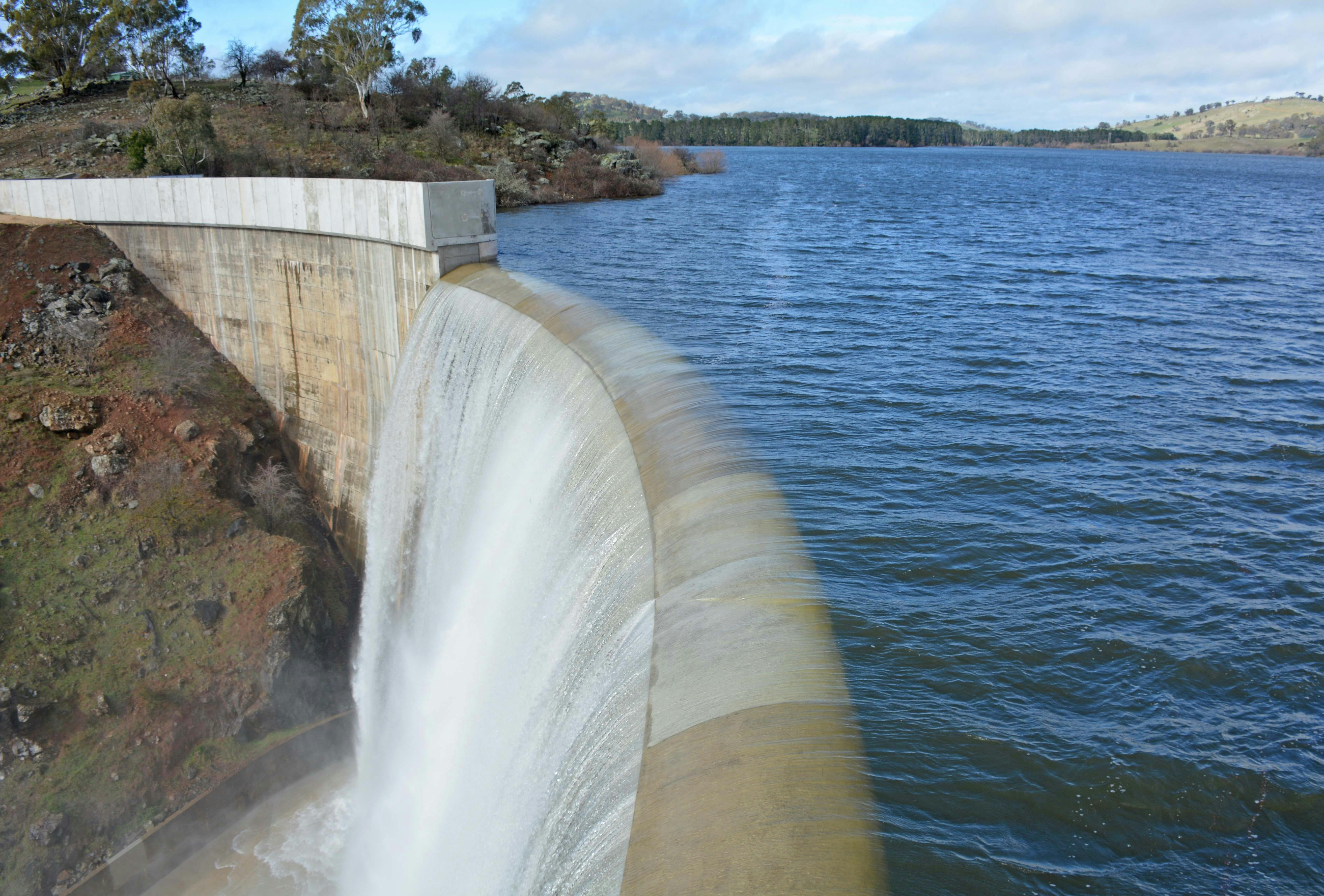 Water flows over the new higher dam wall at Suma Park
