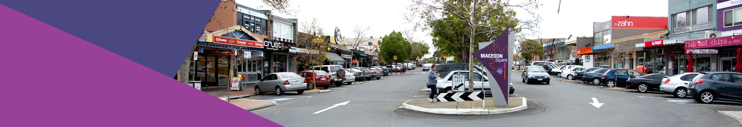 Macedon Square Streetscape Upgrade showing open paved space and people walkiing with shaded area and t=steps down from the car park. 