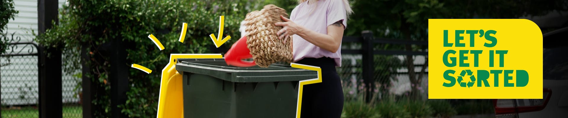 Image of person using a rubbish bin