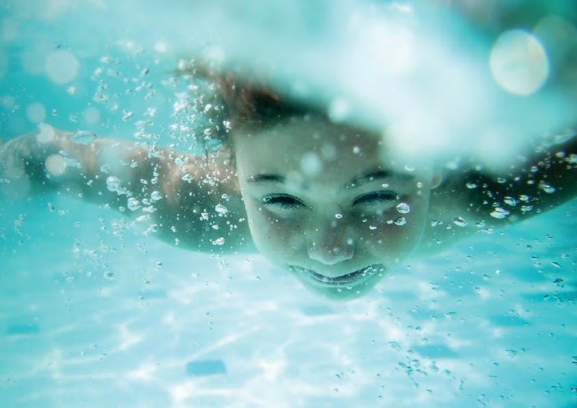 Child Swimming Underwater