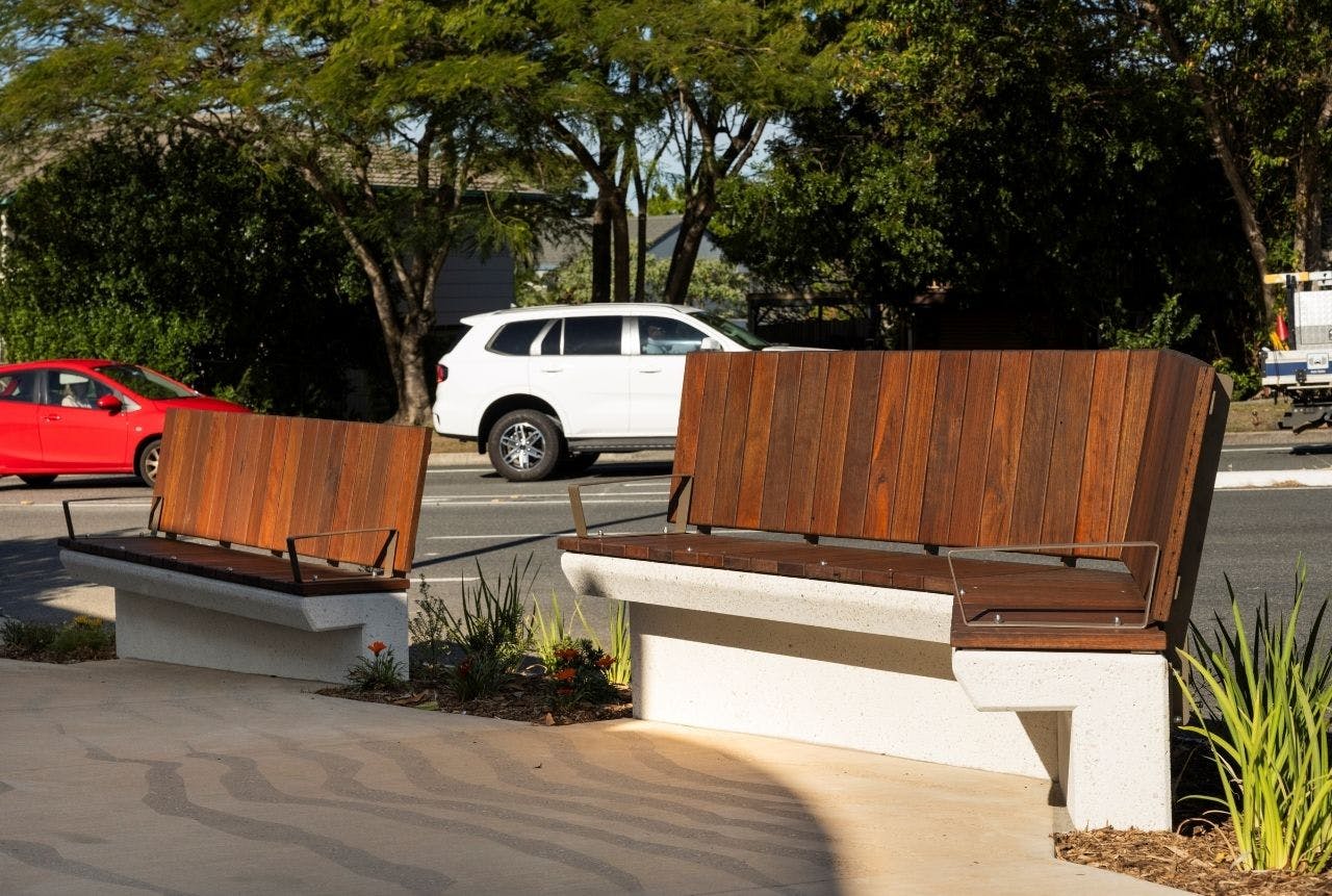 Seating node with creative pavement finish, unique seating and garden beds