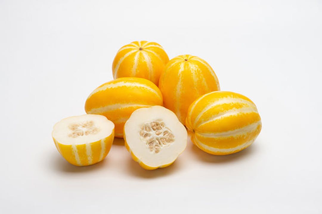 Fresh yellow Korean melon cut and white background