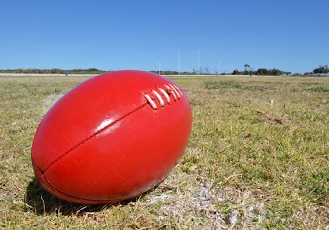 Red football on an oval