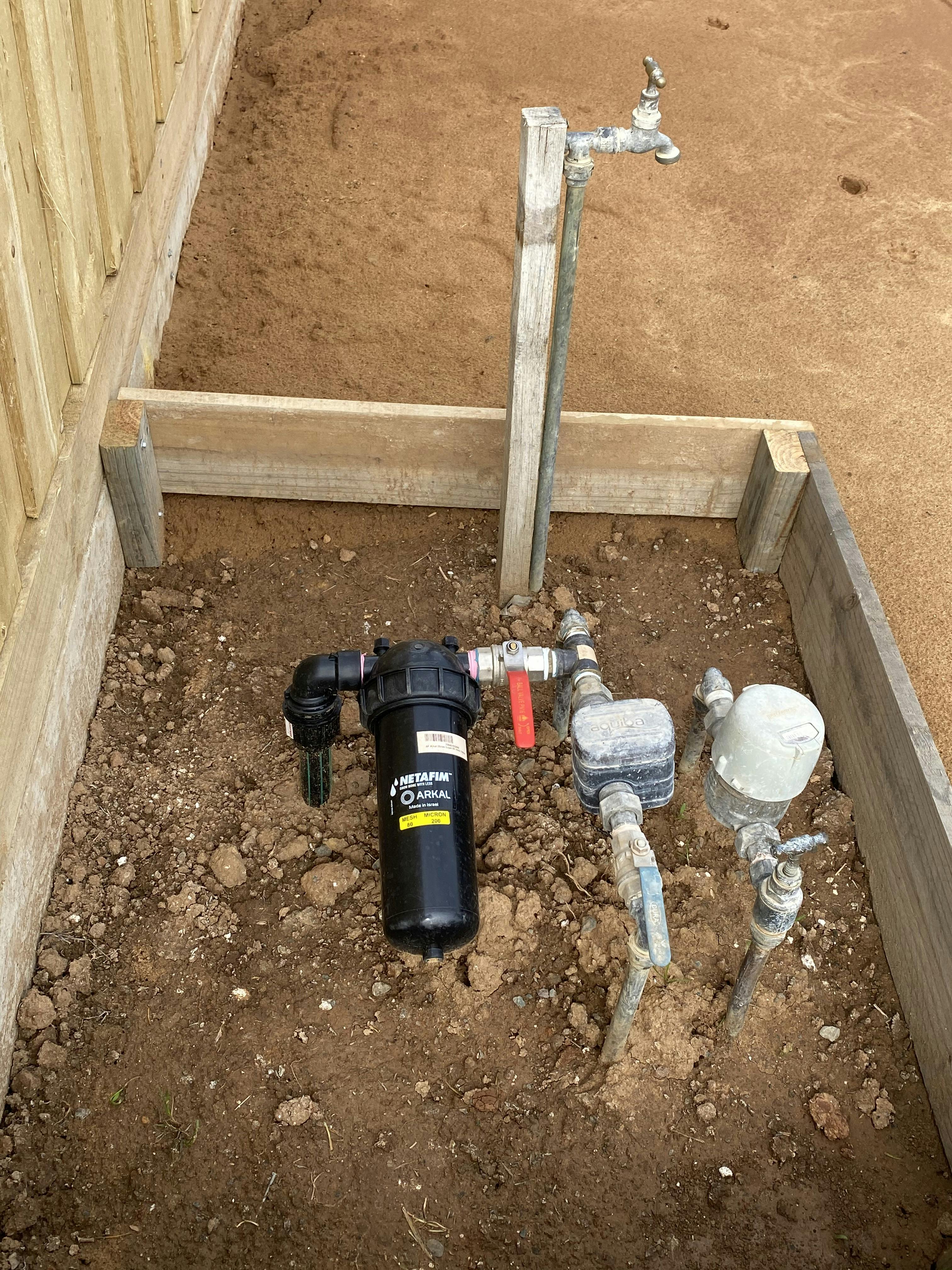 Newly installed and boxed dual water meter. 
