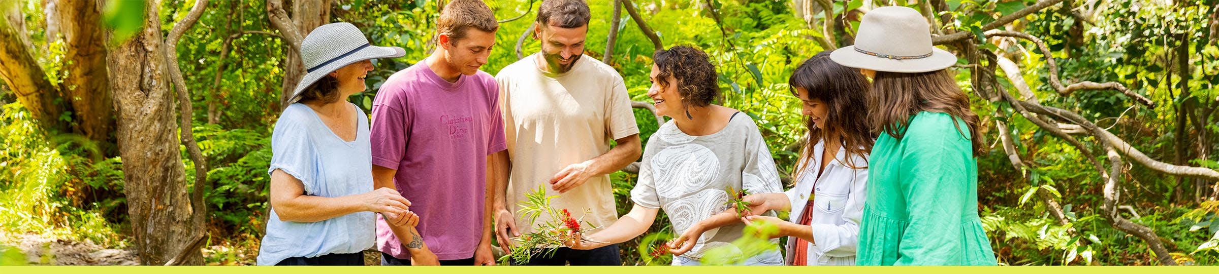 People connecting with flora through Indigenous interpretation. Image by Tourism and events Queensland.