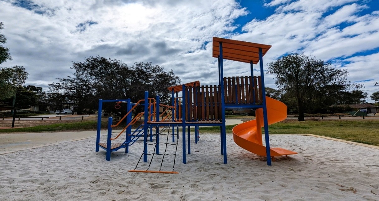 Traditional – Swing, slide, combination unit (tower), made from metal and plastic, confined to sand pit.