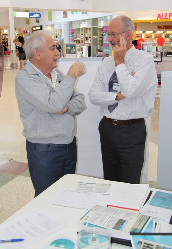 Council's Works Unit Manager, Ian Kite (right), listens to feedback from a visitor to the Tweed City community information stall.