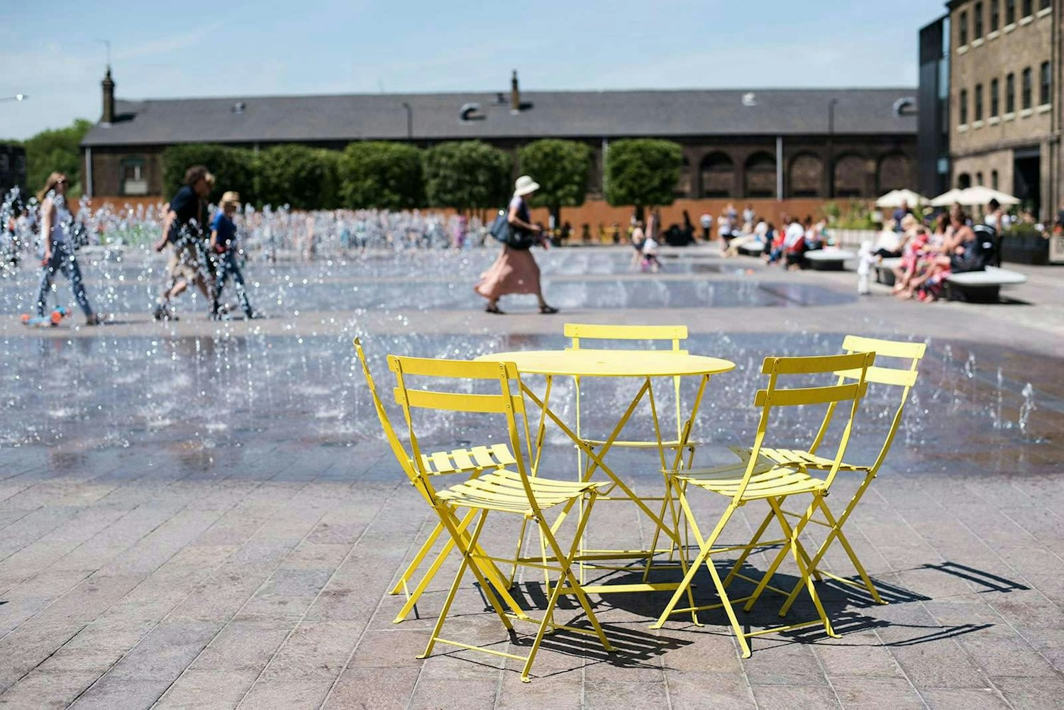 Public space to encourage play such as fountains and seating (example image provided)