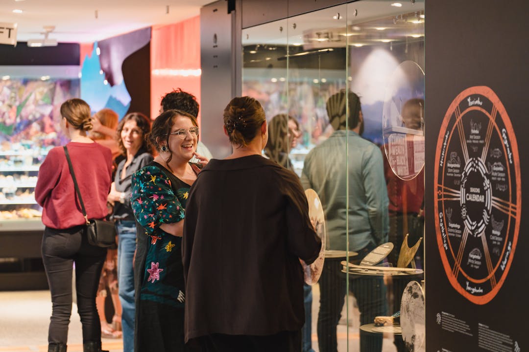 Museum attendees conversing at the recent Omnia Exhibition launch