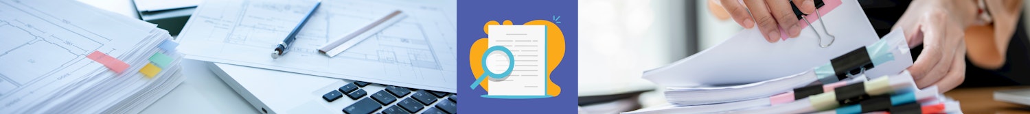 Laptop computer and planning documents on a desk