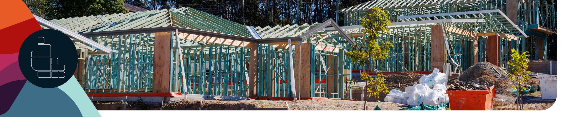 Houses being built, currently in the structural framework stage.