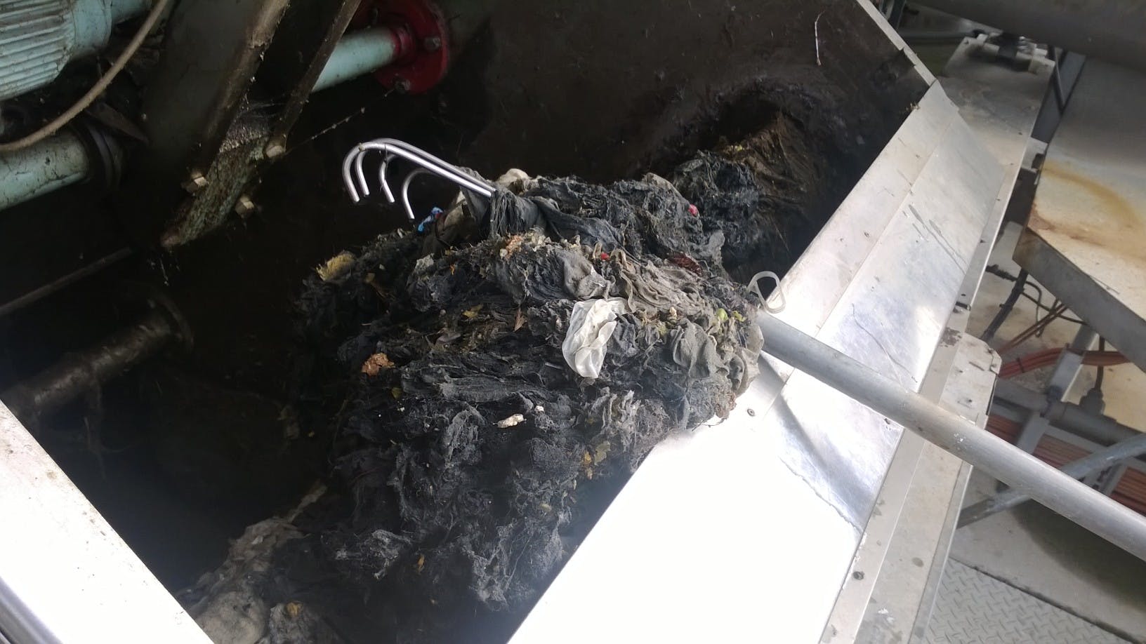 Removing wipes and other non-flushable objects from our system at our Liverpool Wastewater Treatment Plant