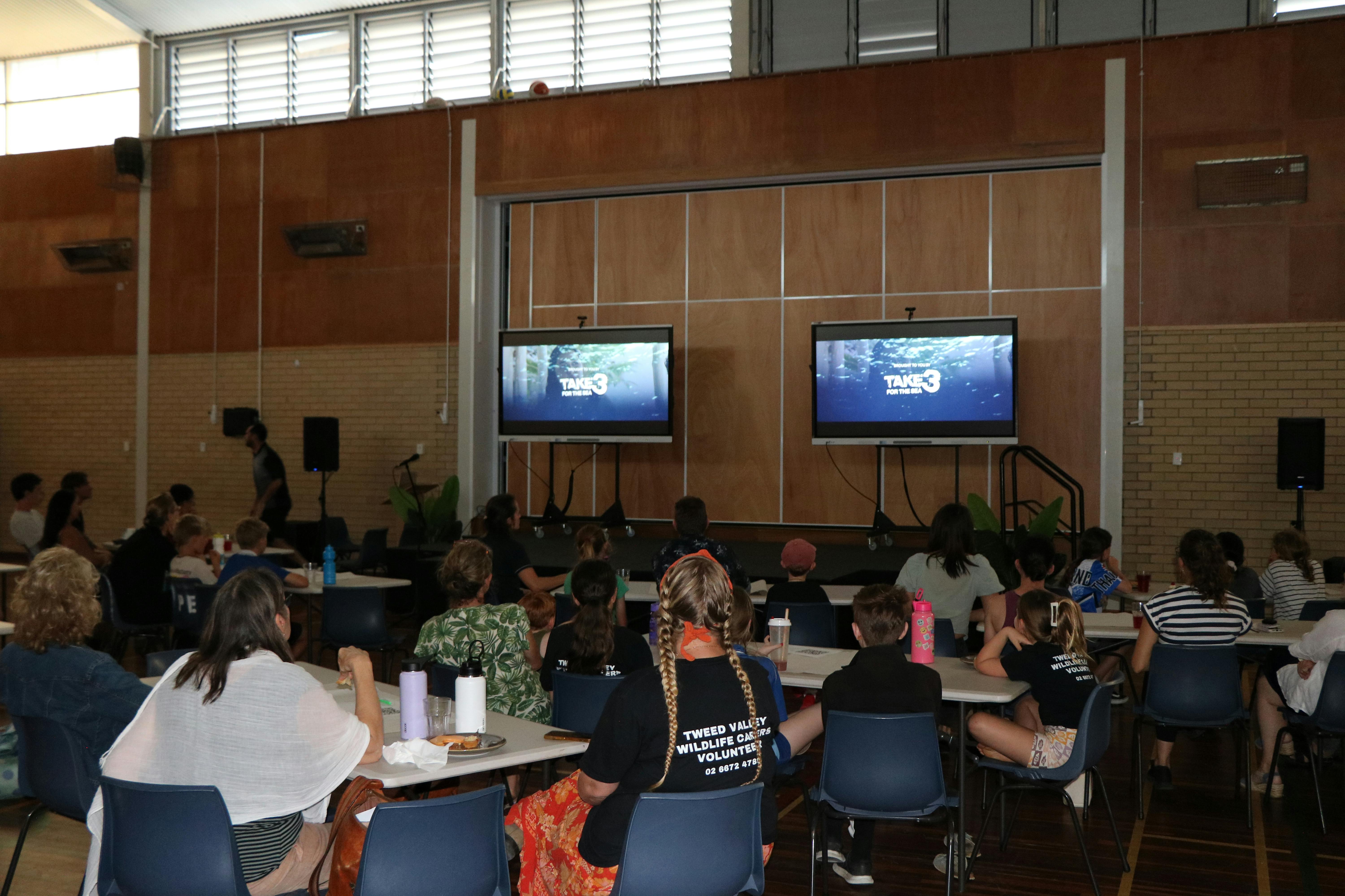 Crowd watching Rising Up screening