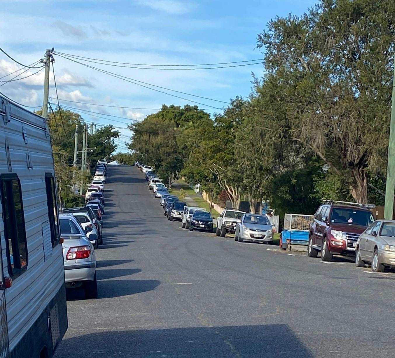 Another photo of cars parked along both sides of Hunter Street, Greenslopes