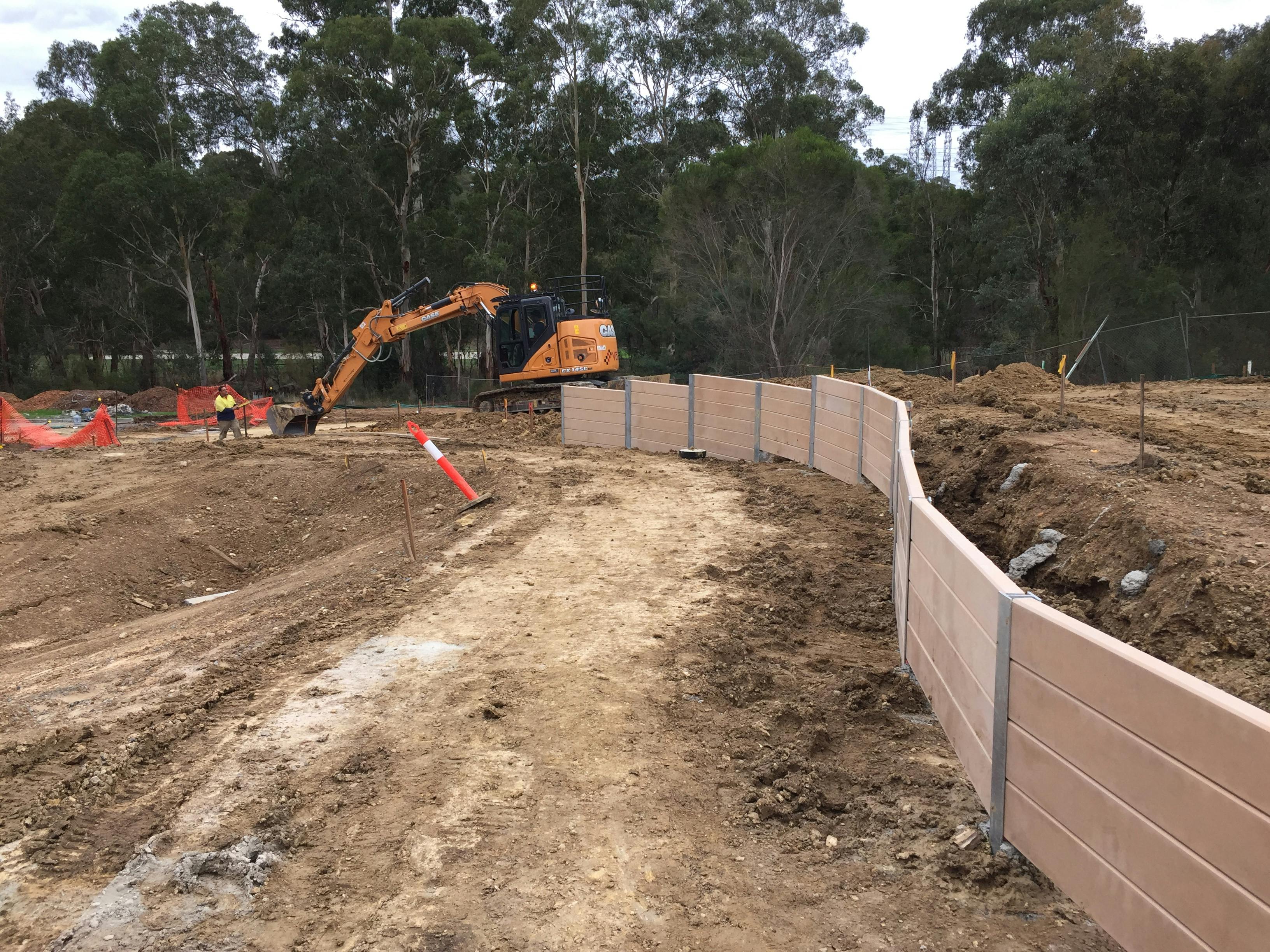 Installation of retaining wall at the new roundabout construction site.